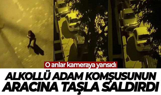 Alkollü adam komşusunun aracına taşla saldırdı, o anlar kameraya yansıdı