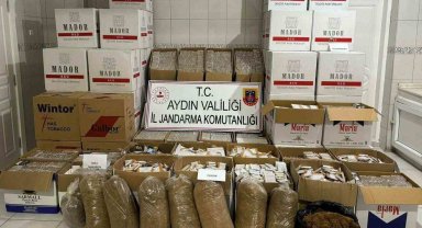 Semt pazarında kaçak sigara satarken yakalandı