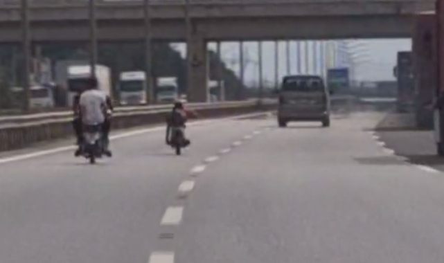 Otobanda motosikletin üzerine yatarak canını hiçe sayan çılgın sürücüye 10 bin TL ceza