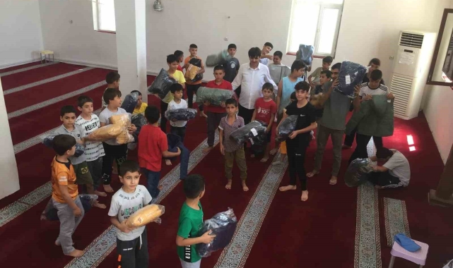 Dicle Kaymakamlığı'ndan başarılı Kur'an kursu öğrencilerine bisiklet ve kışlık kıyafet hediyesi