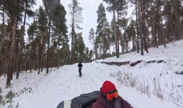 Kars'ta 2 kişi ATV araca bağladığı halatla snowboard yaptı