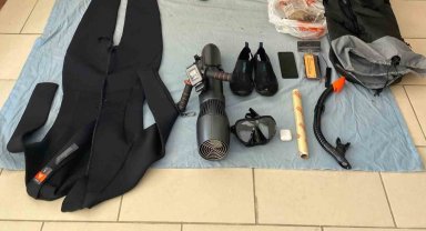 Sisam Adası'na denizden sualtı scooter ile geçmeye çalışırken yakalandı