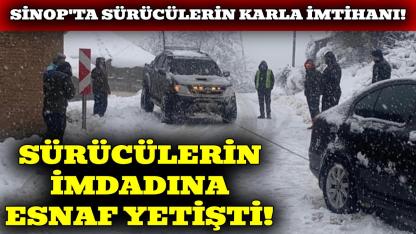 Sinop'ta karda mahsur kalan araçlara esnaf desteği